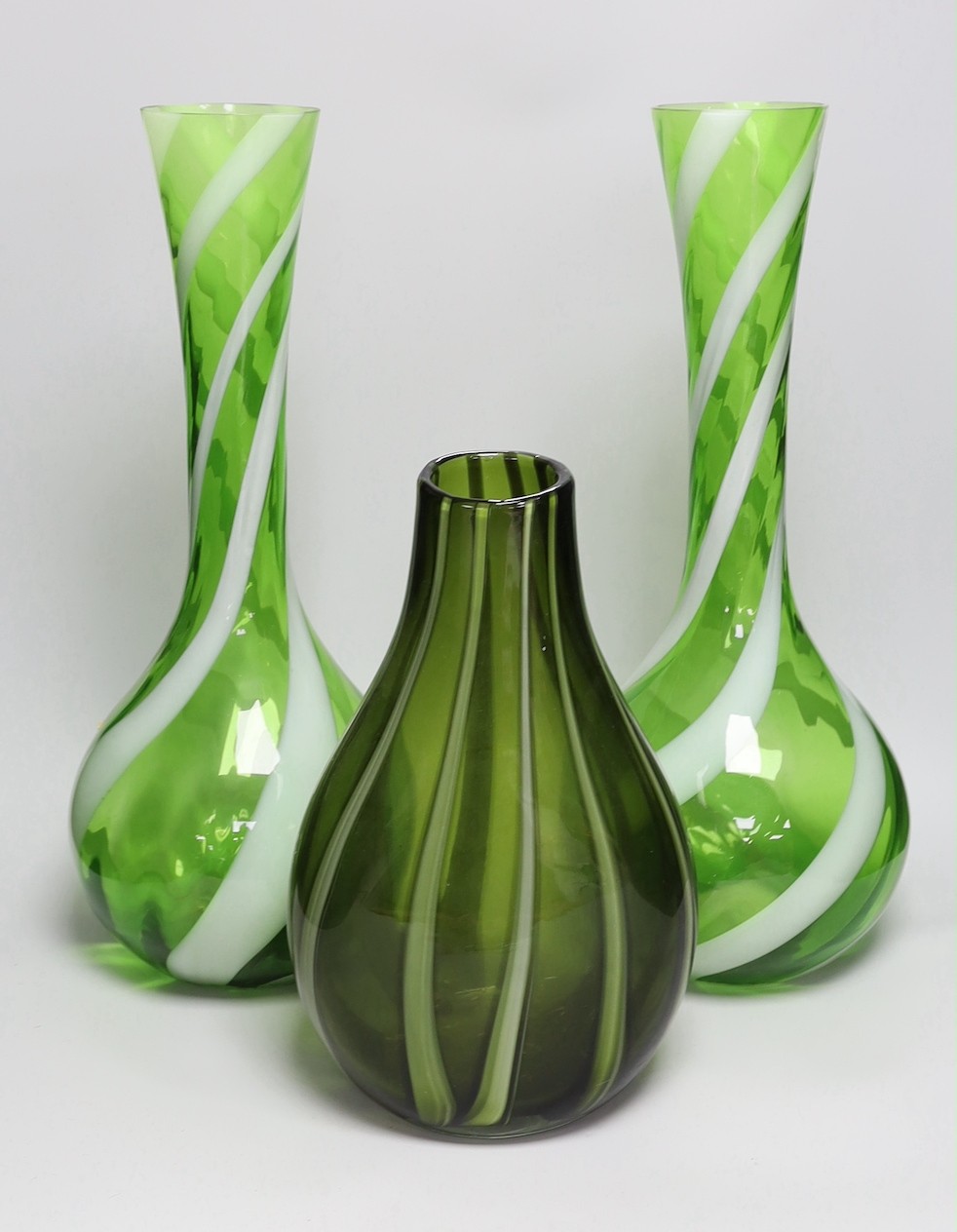 A pair of tall Murano green and white swirled glass vases and another Murano glass vase, tallest 50cm